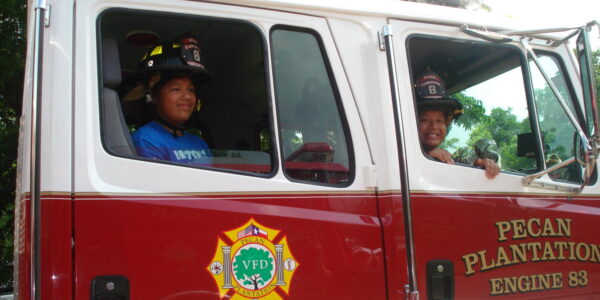 Children seated in fire truck